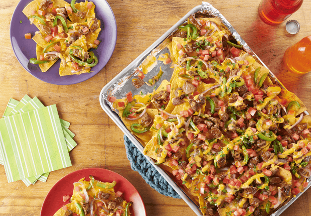 Steak and Veggie Fajita Nachos on a baking sheet